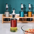 Glass Oil Dispenser Bottle – Stainless Steel Pourer | Leak-Proof Kitchen Oil & Vinegar Container 300ML